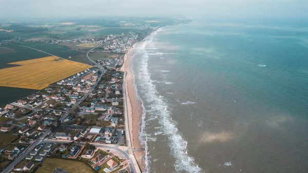 Aerial view of houses along the beach in Normandy, France. The Normandy & Western Front series reflection post