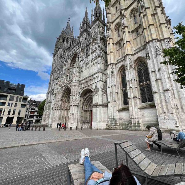 Mom viewing cathedral at Rouen in Normandy, France. The best viewpoint, museum and cafe in France