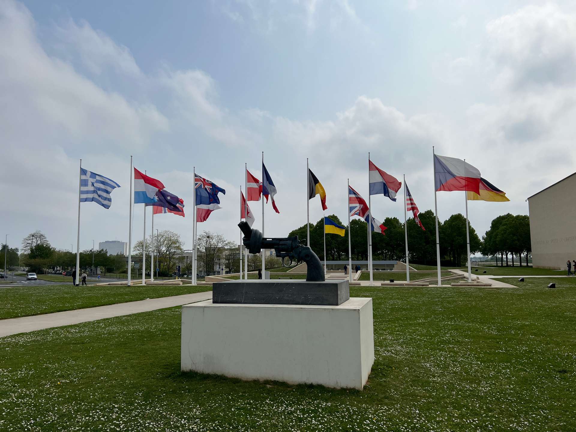Sculpture and flags in Caen Memorial in Normandy, France. The best viewpoint, museum and cafe in France