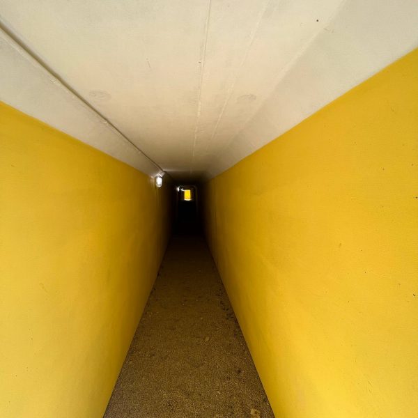 Narrow concrete corridor in Crisbecq Battery in Normandy, France. The best steak & omelette in the world in the same day