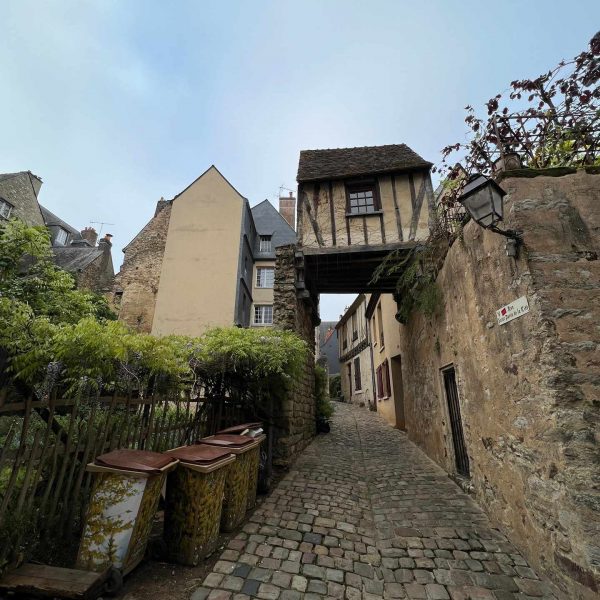 Alley along two houses joined together at a neighborhood in Le Mans, France. Is this the best island in the world?