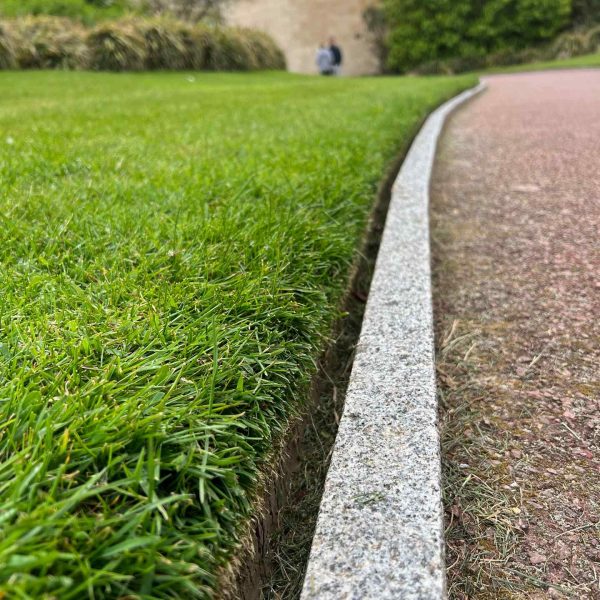 Manicured lawn in American cemetery in Normandy, France. Is there any such thing as a good beach in Normandy?