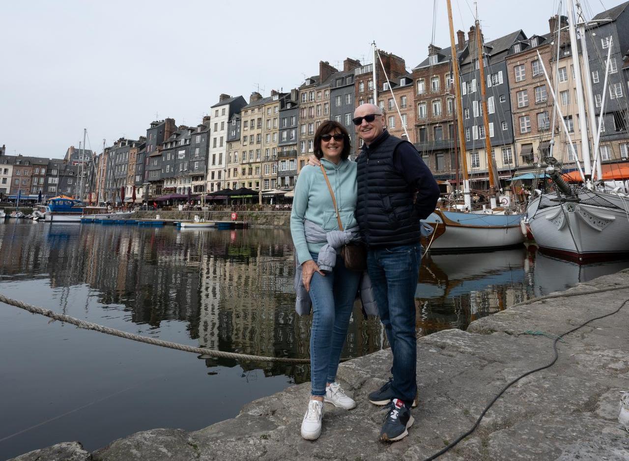Mom and dad at Honfleur harbor in Normandy, France. The best viewpoint, museum and cafe in France