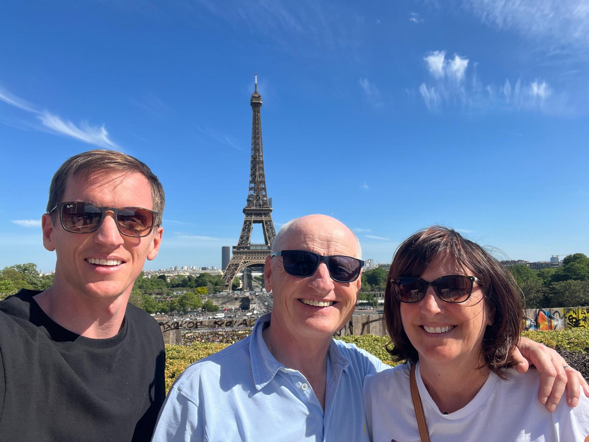 David Simpson with mom and dad and Eiffel Tower in Paris, France. Finishing up in Paris