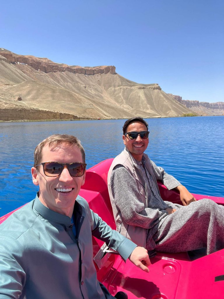 David Simpson with local guide riding pedal boat in a lake in Afghanistan. The Afghan series