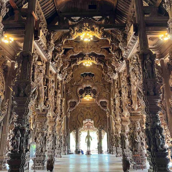 Columns woodcarving at Sanctuary of Truth in Pattaya, Thailand. A Mcdonalds feast and the Sanctuary of Truth