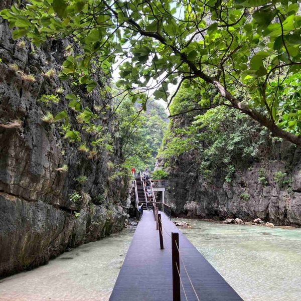Wooden path at Maya Bay beach in Thailand. Boat ride from hell, island hopping from heaven