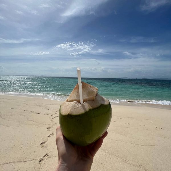 fresh coconut at the beach in Bamboo Island, Thailand. Boat ride from hell, island hopping from heaven