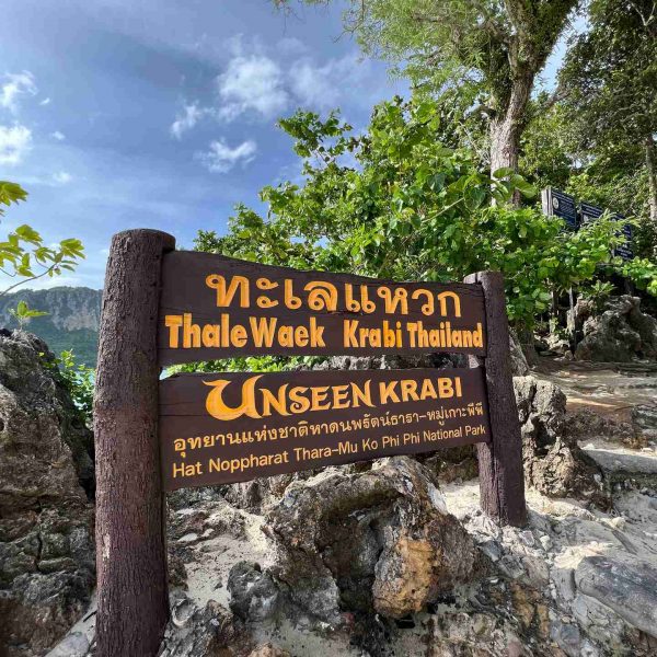Sign at the beach in Thale Waek in Thailand. Boat ride from hell, island hopping from heaven