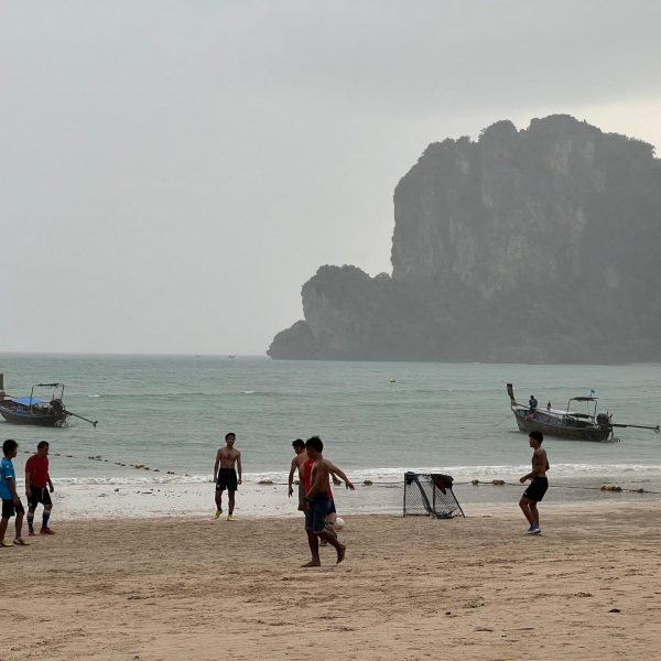 People by the beach in Railay Beach Resort, Thailand. Arriving at Railay Beach and leaving my flip flops