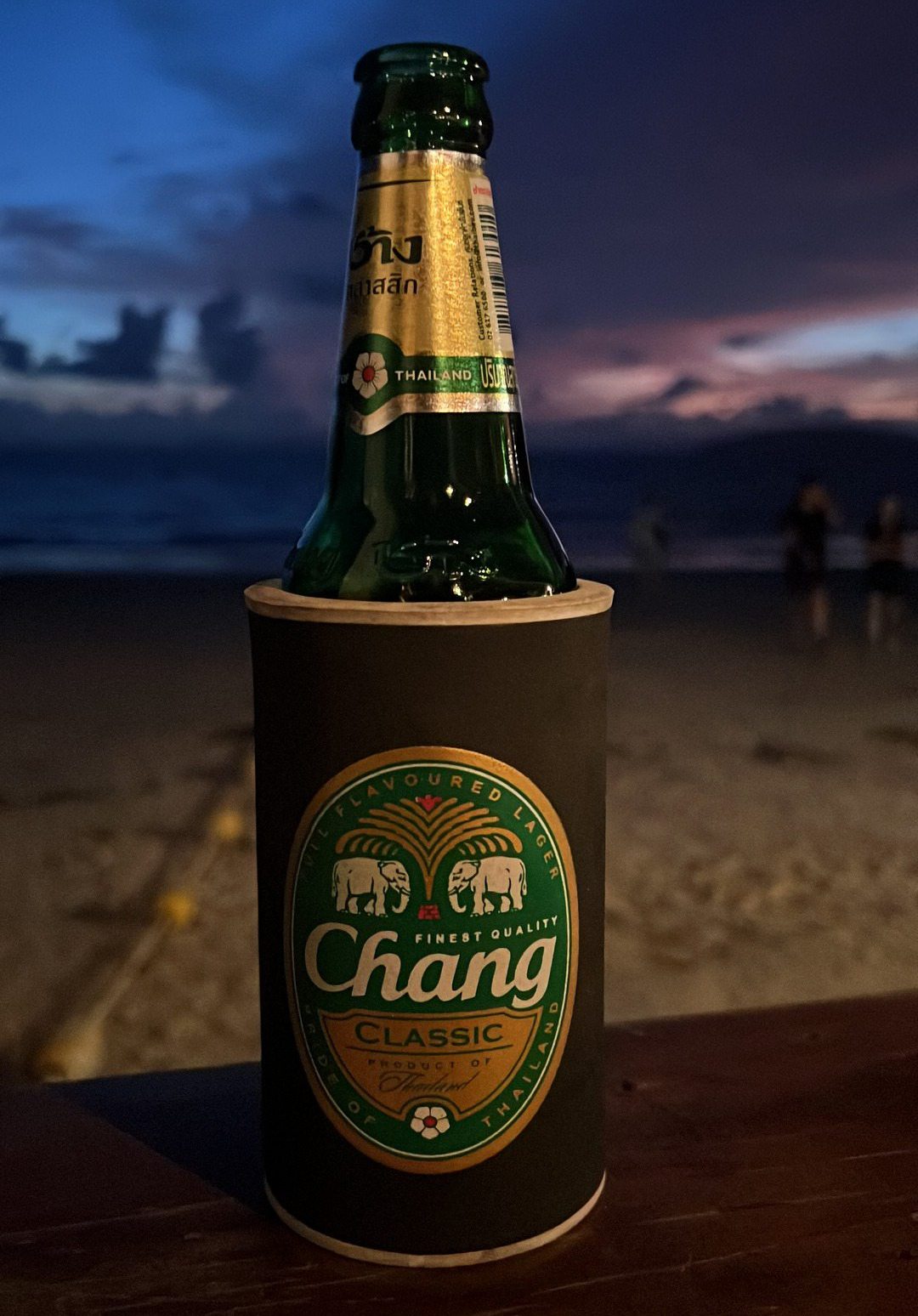 Bottle of Chang beer at Railay Beach in Thailand. Shotguns, markets and temples in Bangkok