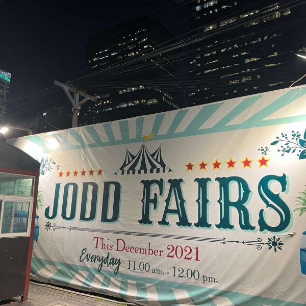 Jodd Fairs sign in Bangkok, Thailand. Insects a la carte & a broken bus