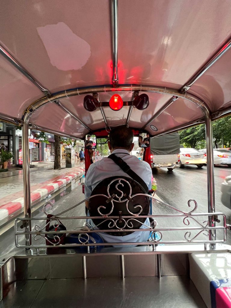Tuktuk and driver in Bangkok, Thailand. The day to end all days in Bangkok