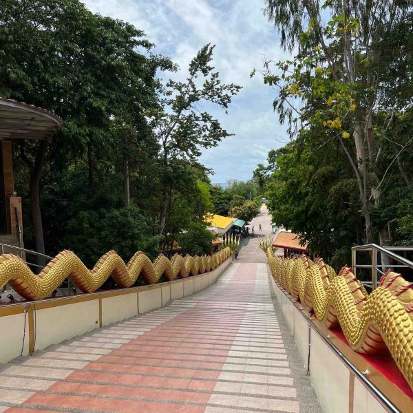 Giant snakes staircase in Wat Phra Yai, Thailand. Buddha Mountain, floating market, Golden Buddha, ear spa & an Imperial Massage