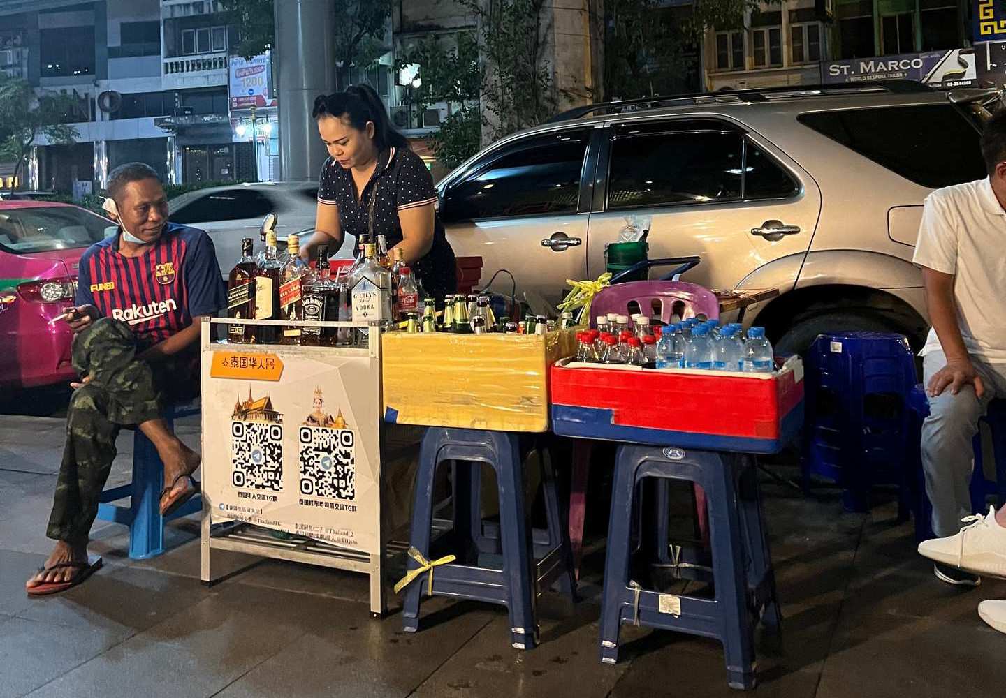 Sidewalk bar at Jodd Fairs in Bangkok, Thailand. Insects a la carte & a broken bus