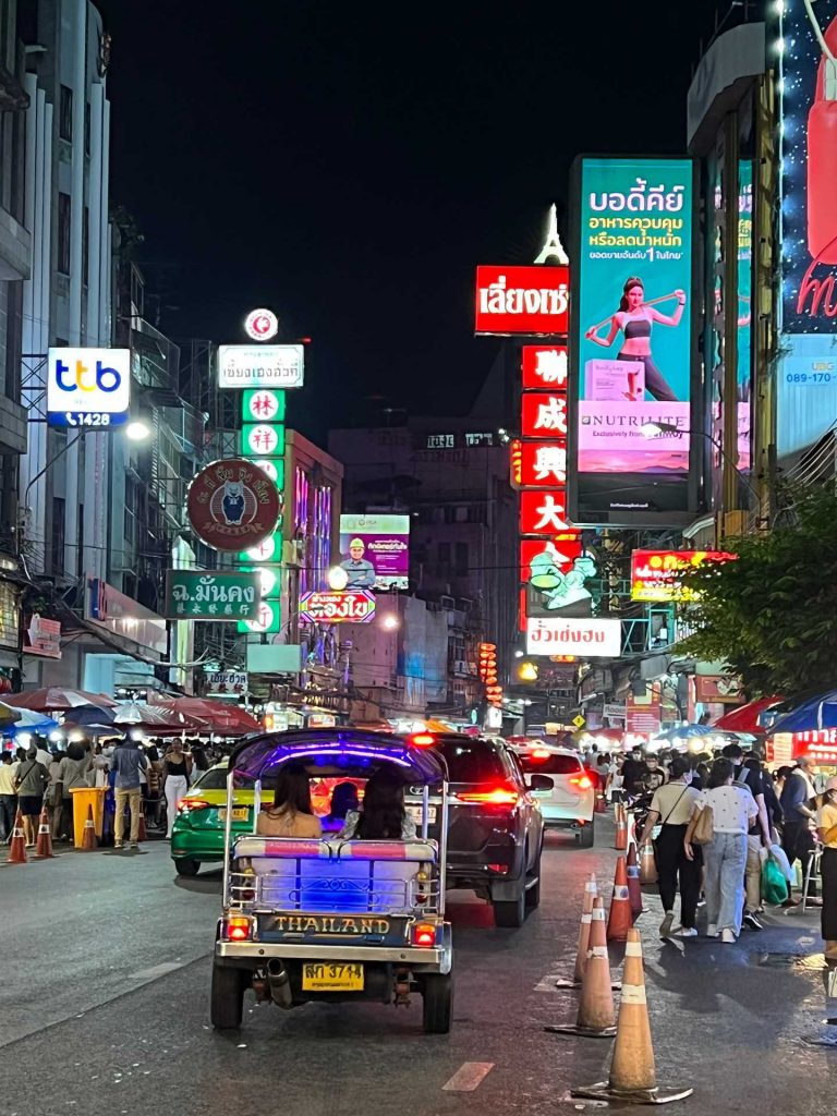 People walking on the street at night at Chinatown in Bangkok, Thailand. The day to end all days in Bangkok