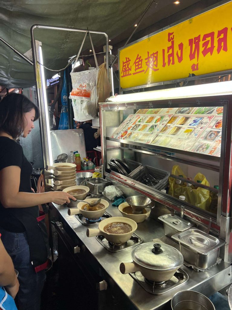 Vendor at Chinatown food stall in Bangkok, Thailand. The day to end all days in Bangkok