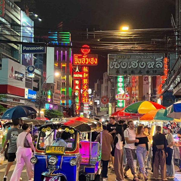 People walking on the street at night at Chinatown in Bangkok, Thailand. The day to end all days in Bangkok
