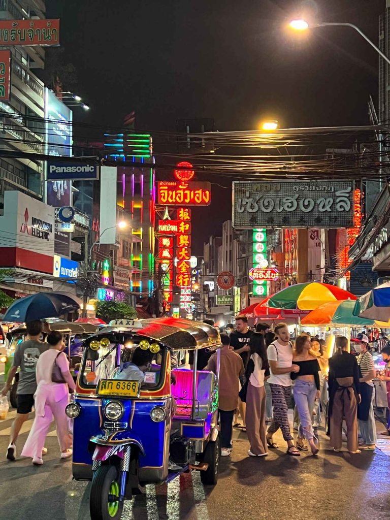 People walking on the street at night at Chinatown in Bangkok, Thailand. The day to end all days in Bangkok