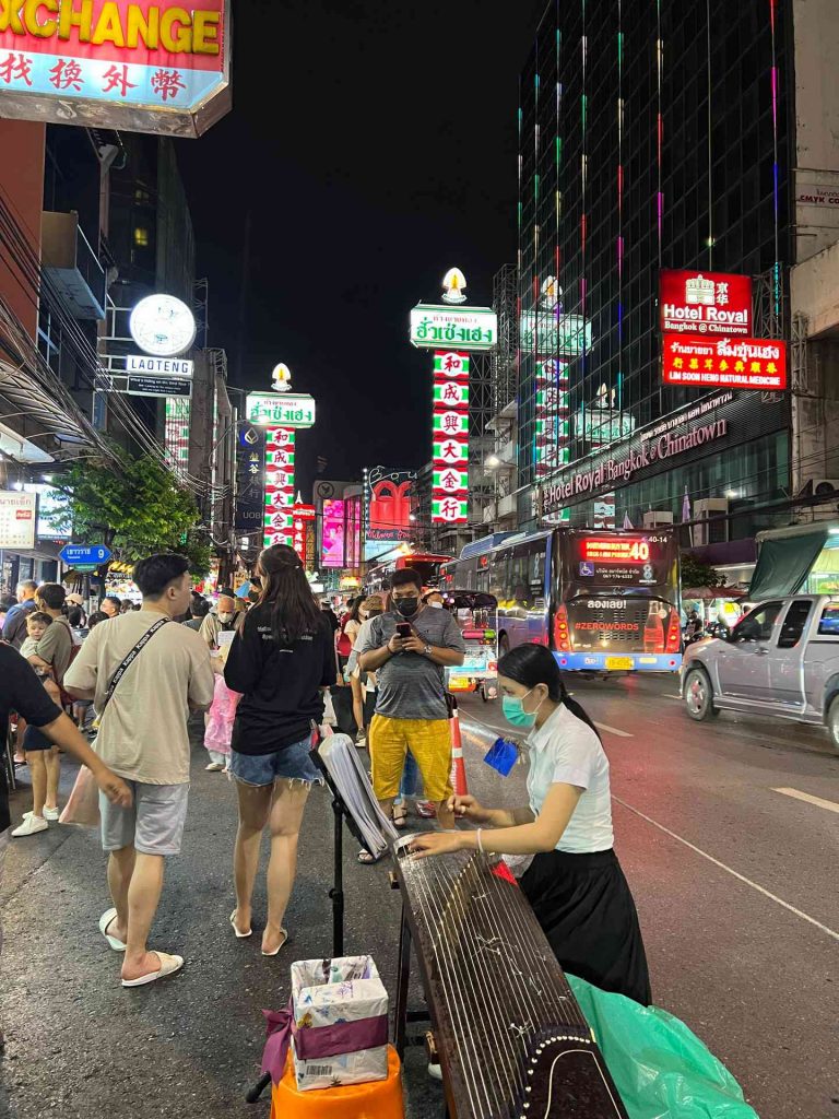 People walking on the street at night at Chinatown in Bangkok, Thailand. The day to end all days in Bangkok