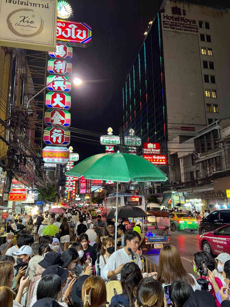 People walking on the street at night at Chinatown in Bangkok, Thailand. The day to end all days in Bangkok
