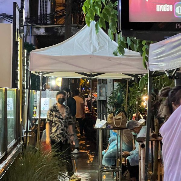 Tent and people at alley in Bangkok, Thailand. Ayutthaya, food frenzy & cryo time
