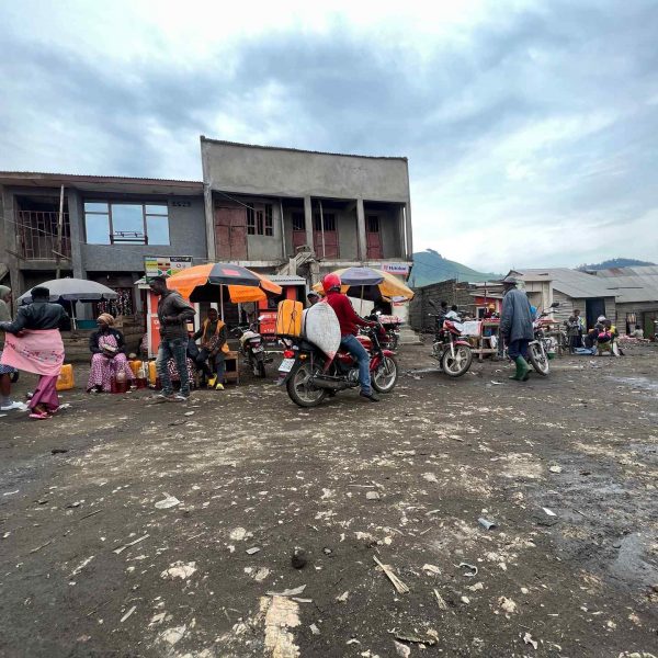 Buildings and locals in Tchegera Island, DRC. Checkpoint trouble and Tchegera Island all alone