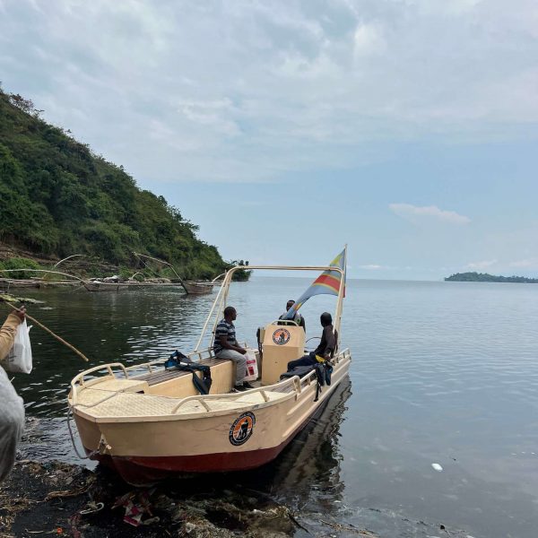 Boat with people docked in Tchegera Island, DRC. Checkpoint trouble and Tchegera Island all alone