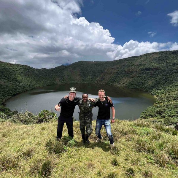 David Simpson and friends on Mt. Bisoke summit in Rwanda. Climbing Mt Bisoke