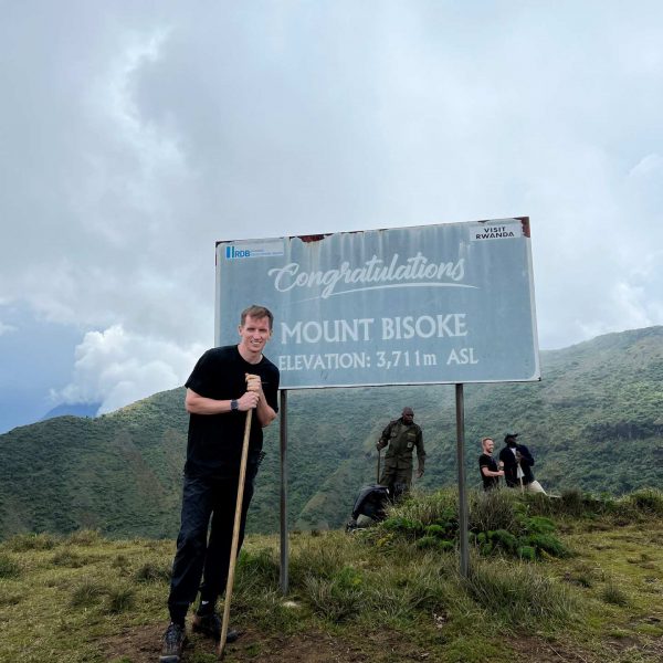 David SImpson and rangers on Mt. Bisoke summit in Rwanda. Climbing Mt Bisoke