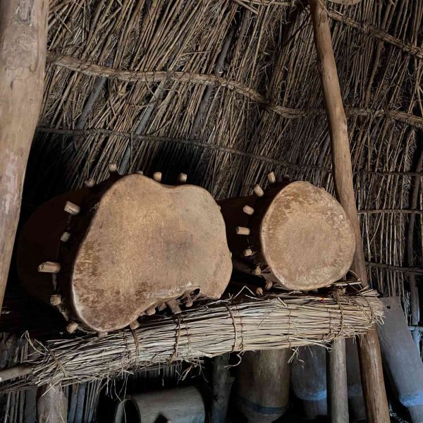 Drums inside the tribal cottage in Burundi. A riot with the Royal Drummers and Batwas of Burundi