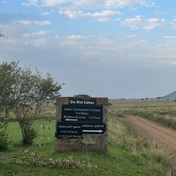 Direction sign in Masai Mara, Kenya. The Great Migration
