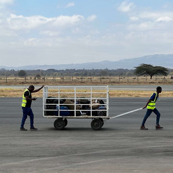 Workers at Arusha airport in Zanzibar, Tanzania. Arriving into Zanzibar