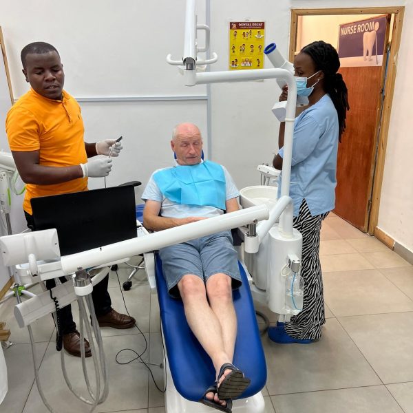 Dad on the dentist chair in Kigali, Rwanda. The Rwandan genocide & a toothache
