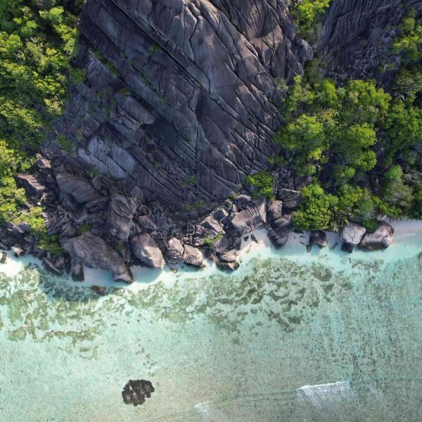 Aerial view of boulders at beach in Anse Source D_Argent, Seychelles. The best beach in the World & rip drone