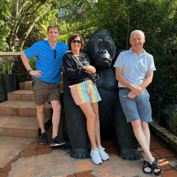 David Simpson, mom, dad near Gorilla statue at Des Mille Collines Hotel in Uganda. Sh*t scared at the Gorilla habituation experience