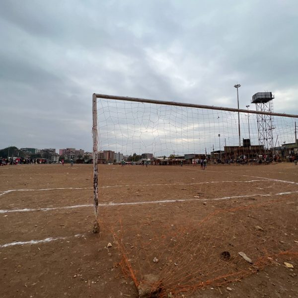 Football field at slums in Nairobi, Kenya. Drone issues & the largest urban slum in Africa
