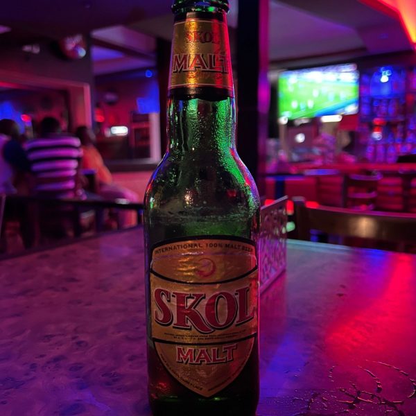 Bottle of Skol beer at the bar in Retreat Hotel in Kigali, Rwanda. The Rwandan genocide & a toothache