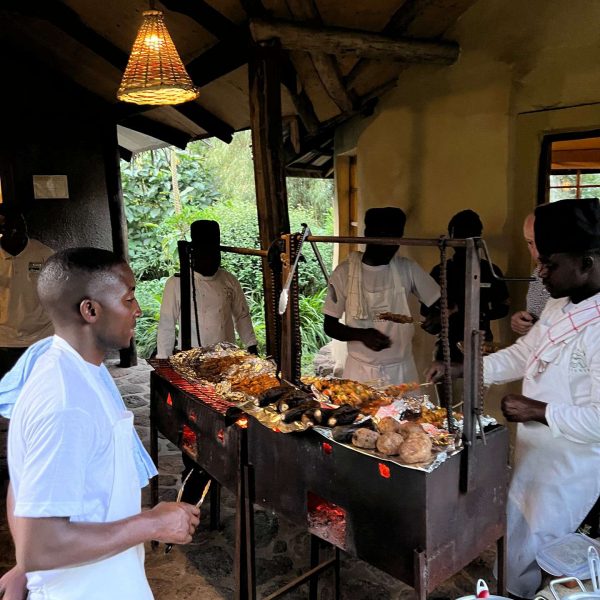 Locals cooks cooking at Mgahinga National Park in Uganda. Uganda Gorilla trek