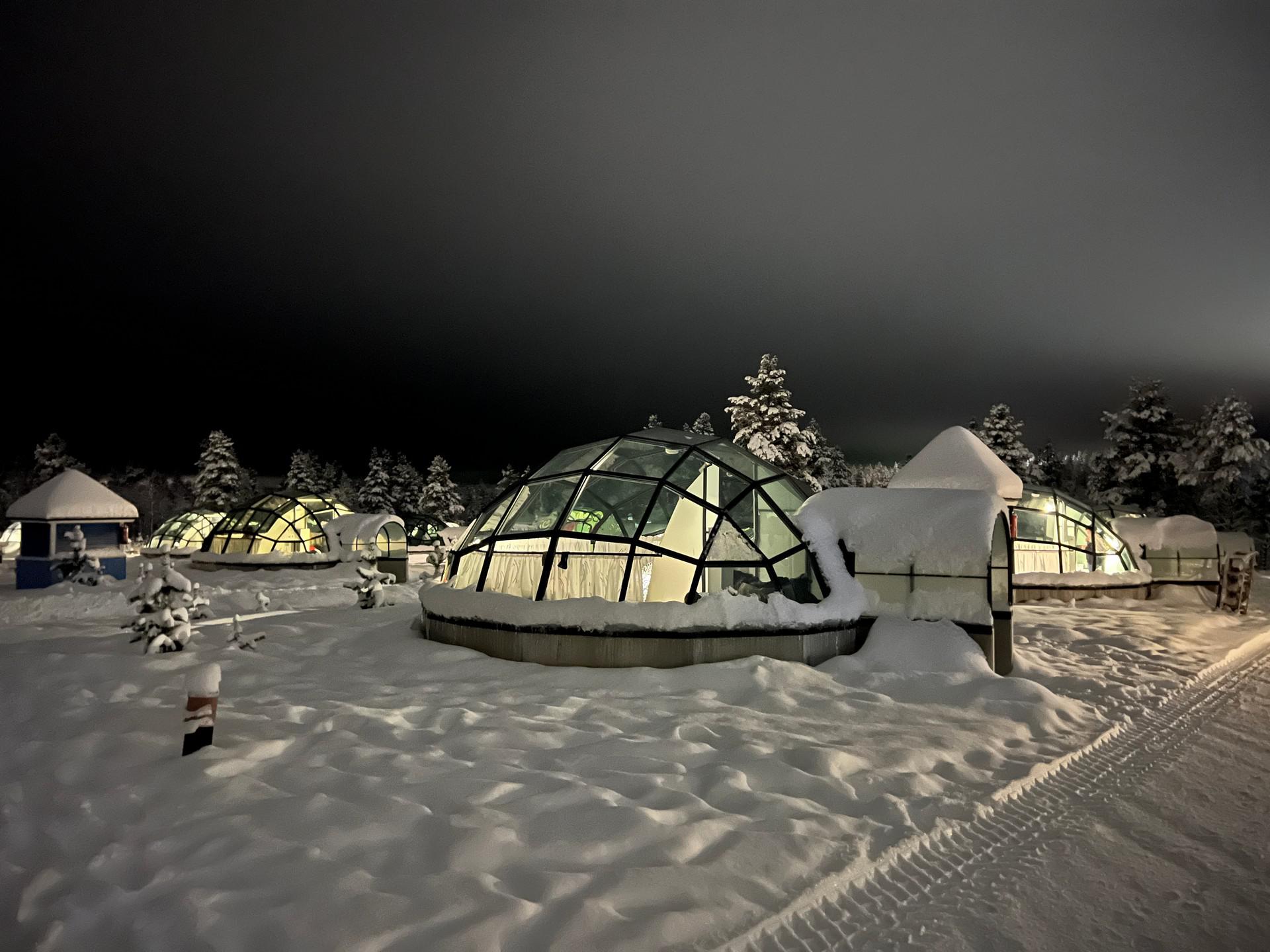 Glass igloo at night in Ivalo, Finland. The Lapland Series reflection post