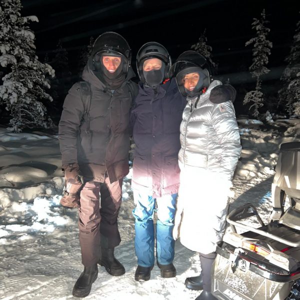 David Simpson, mom and dad standing in the snow at night in Ivalo, Finland. The truth about Kakslauttanen Arctic resort