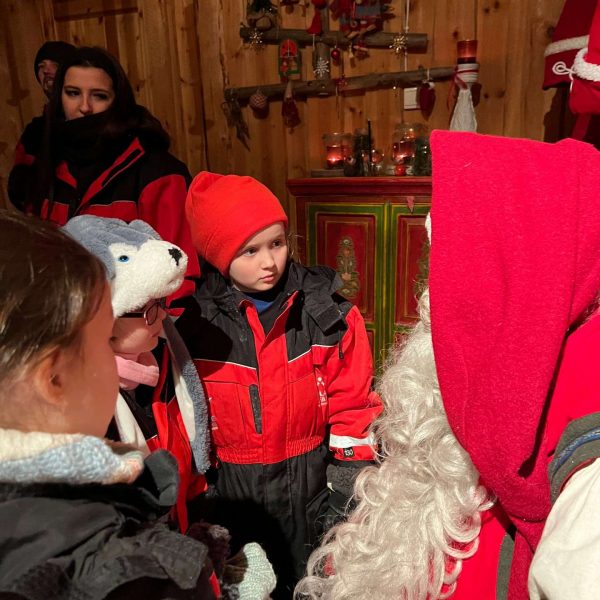 Nieces with Santa in Saariselka, Finland. Arriving in Santa Claus Village