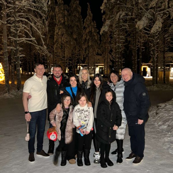 David Simpson and family at night in Rovaniemi, Finland. Christmas Day in Lapland