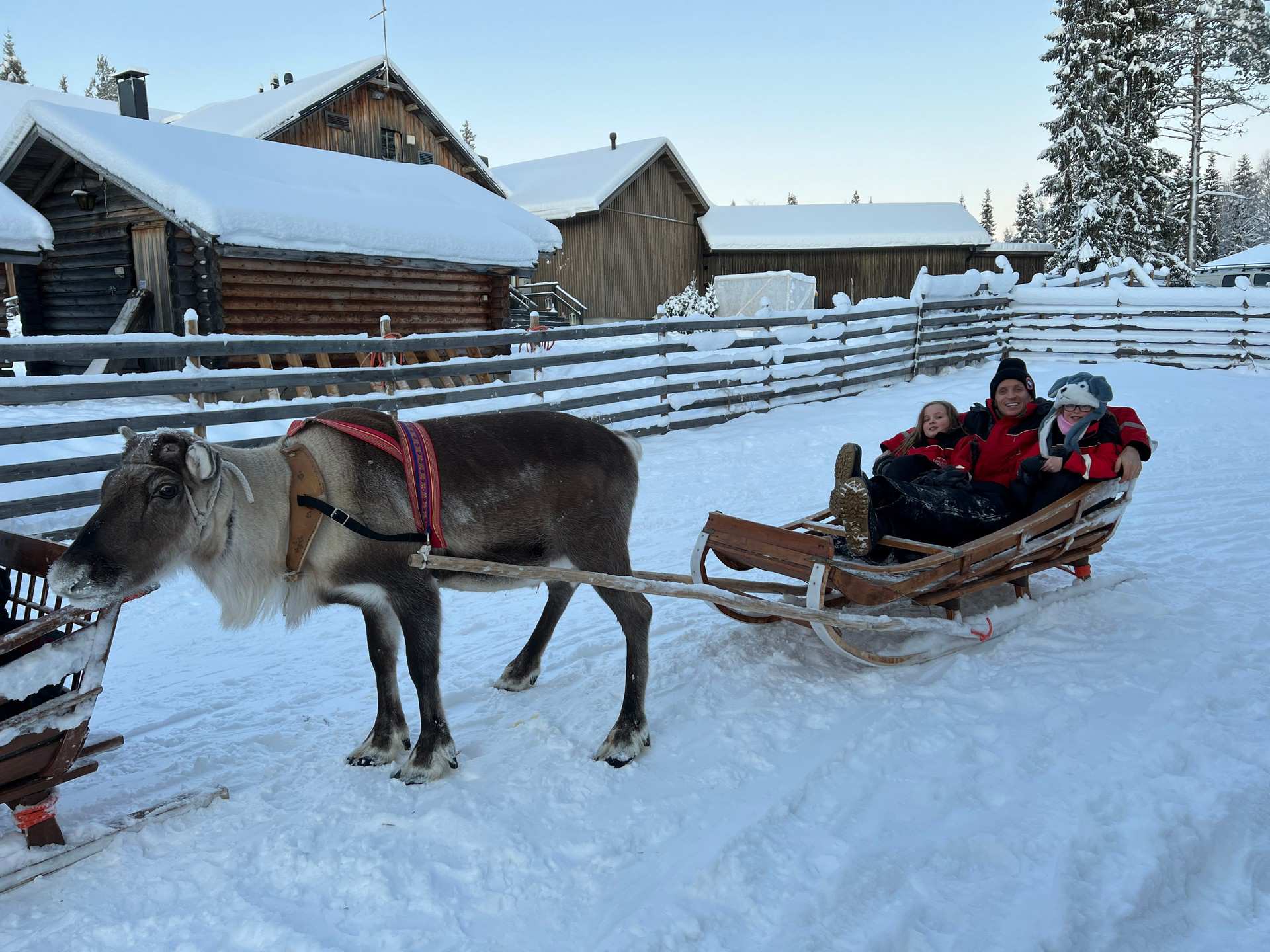 David Simpson and nieces riding sleigh in Saariselka, Finland. Arriving in Santa Claus Village