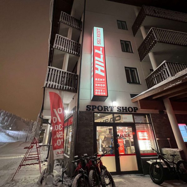 Building with sports shop at night in Ruka, Finland. Reindeer yoga, vengeance & NYE