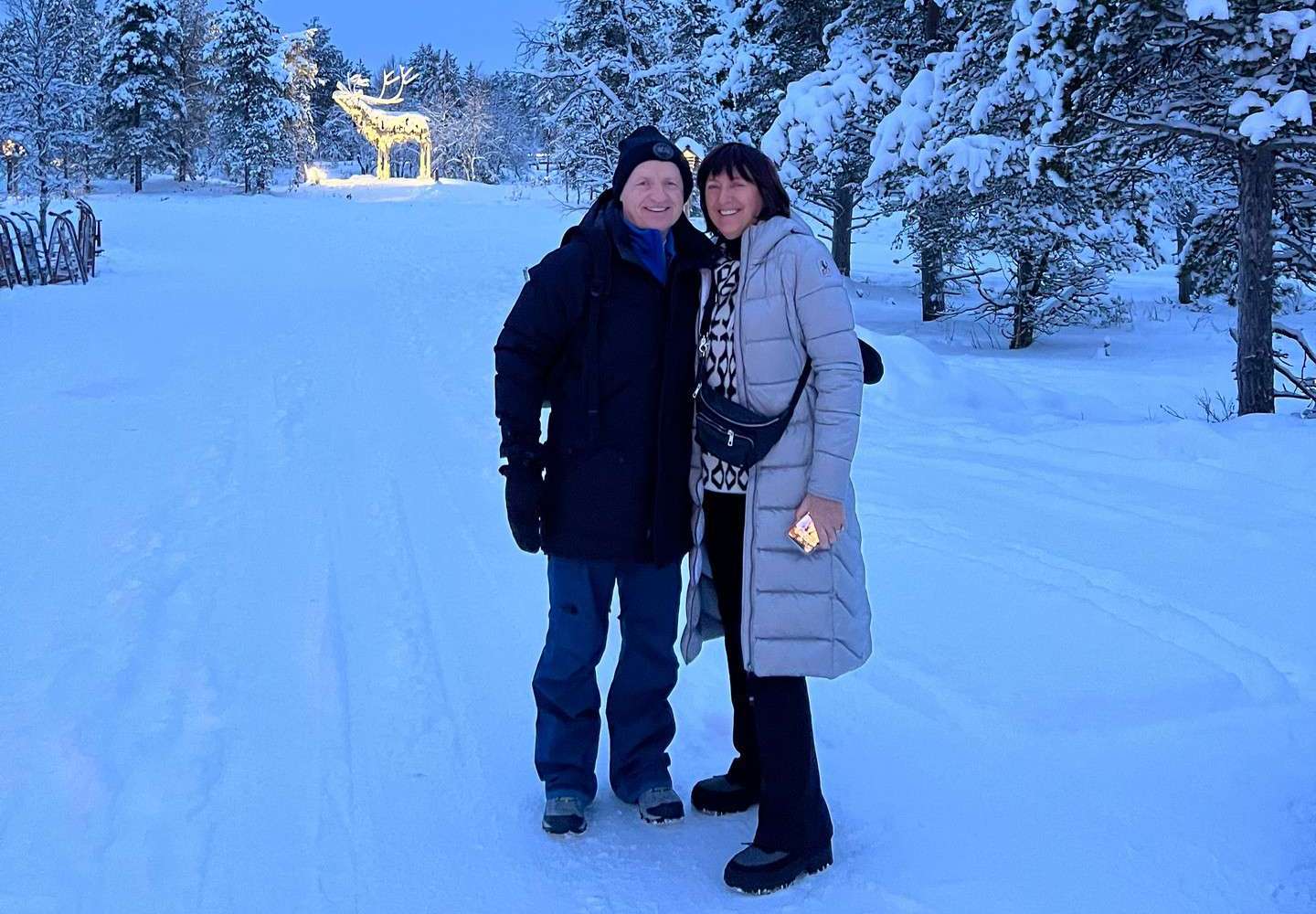 Mom and dad on the snow in Saariselka, Finland. Frozen karting & husky rides