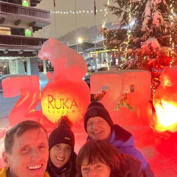 David SImpson with mom, dad and sister by the ice sculpture in Ruka, Finland. Reindeer yoga, vengeance & NYE