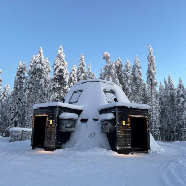 Snow covered cottage in Saariselka, Finland. Arriving in Santa Claus Village