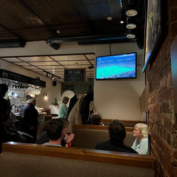 People watching game at a bar in Helsinki, Finland. Helsinki bike, sauna in the room & Messi