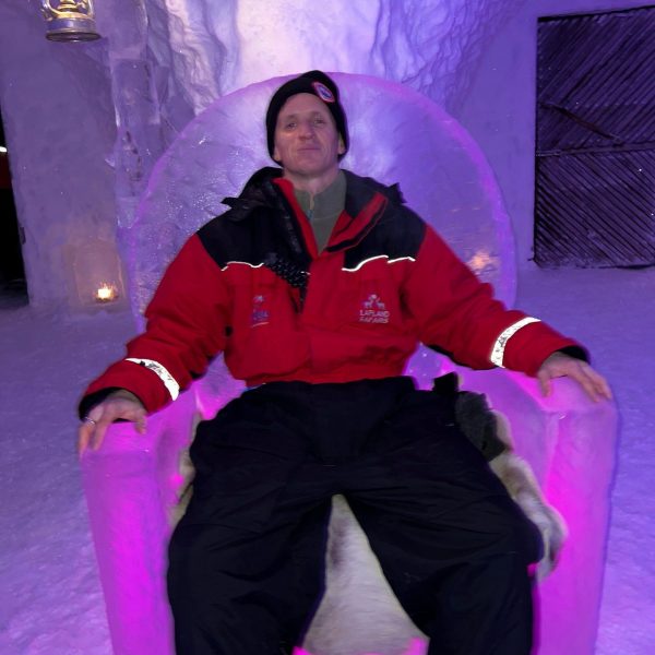 David Simpson sitting on ice throne in Rovaniemi, Finland. Christmas Day in Lapland